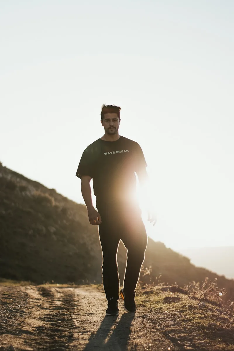 man having back pain, hand on lower back